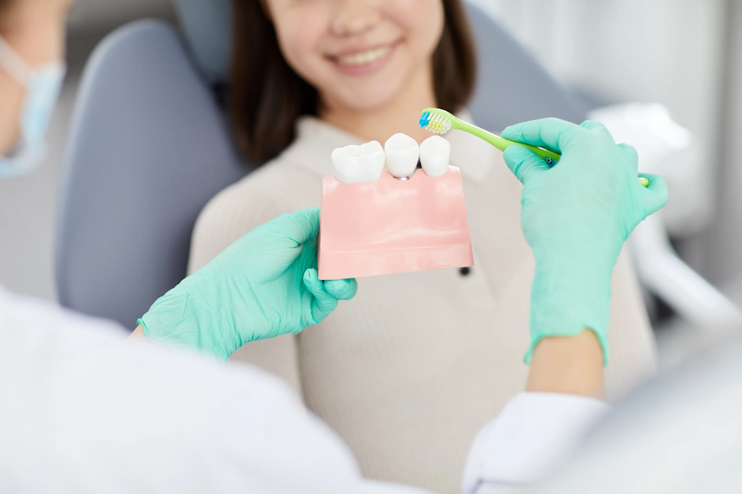 Dentist discussing dental care with a patient